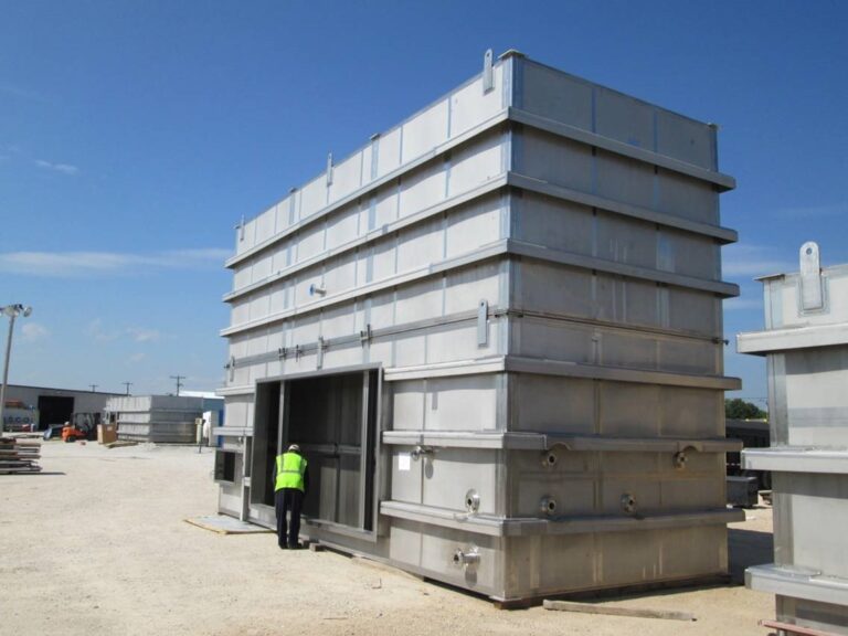 Man working installing the EnviroCare's Advanced MMV Scrubber Technology to Minimize Urea Dust Emission.