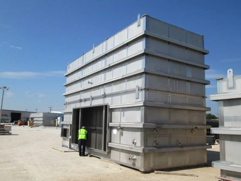 Man working installing the EnviroCare's Advanced MMV Scrubber Technology to Minimize Urea Dust Emission.